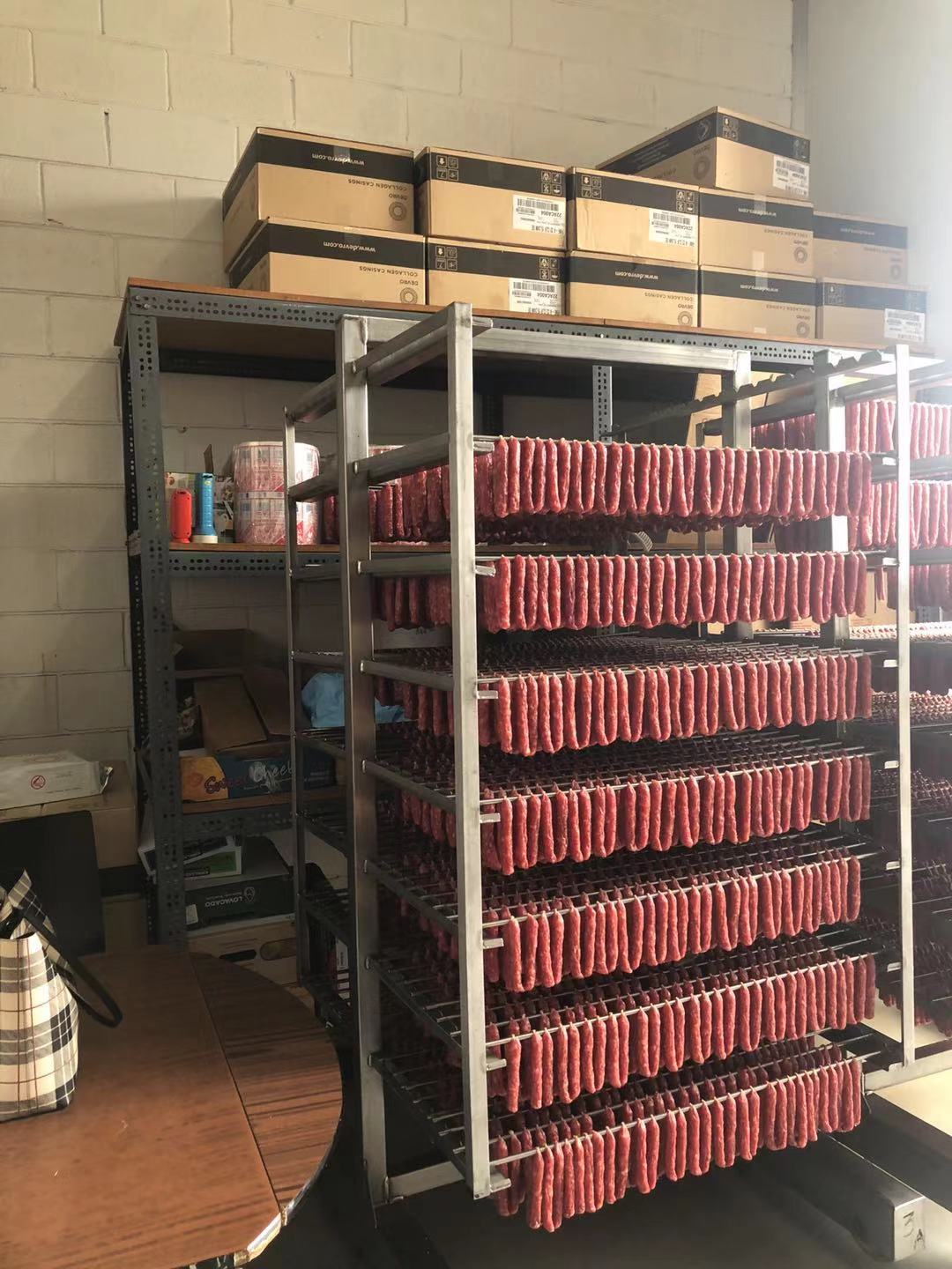 The dried sausages are neatly waiting for packing